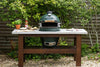 Big Green Egg outdoor pizza setup with fresh ingredients, perfect for creating wood-fired dishes in Northern and Southern Ireland.