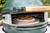 Big Green Egg with Pizza Oven Wedges baking a fresh artisan pizza in Northern Ireland, perfect for creating authentic wood-fired flavors at home.