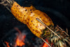 Caramelized pineapple roasting on the Big Green Egg Rotisserie, perfect for desserts in Northern Ireland and Ireland.